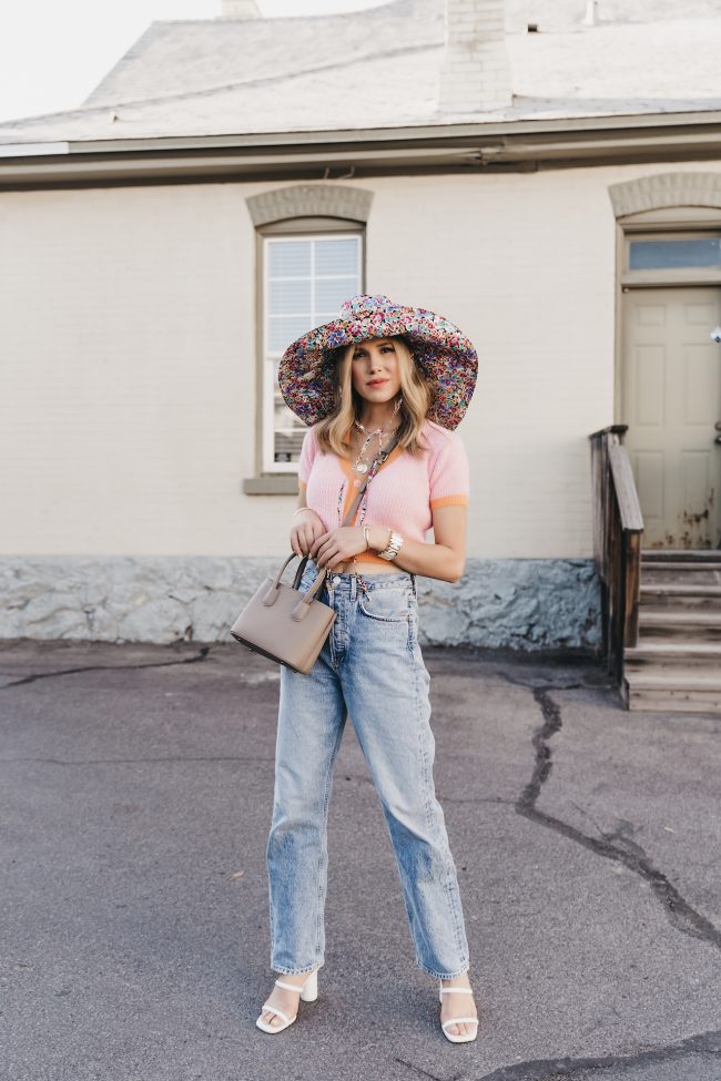 street style fashion blogger wearing a trendy floral bucket hat in the summertime