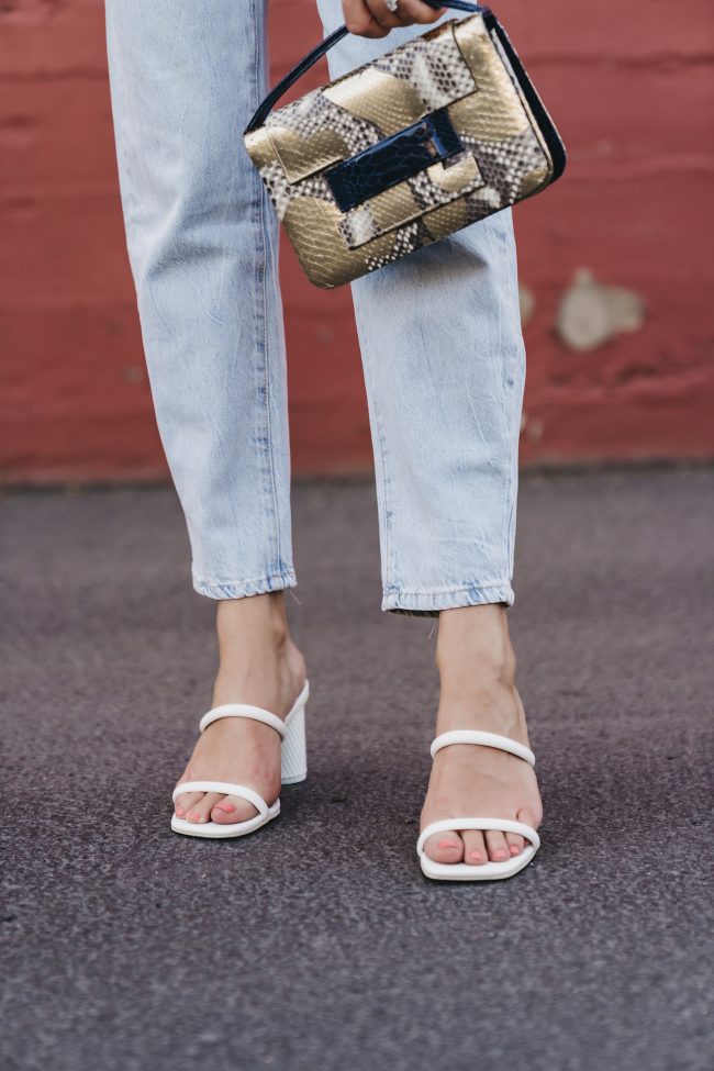 The fashion fuse wearing dolce vita white double strap sandals and a whimsical top