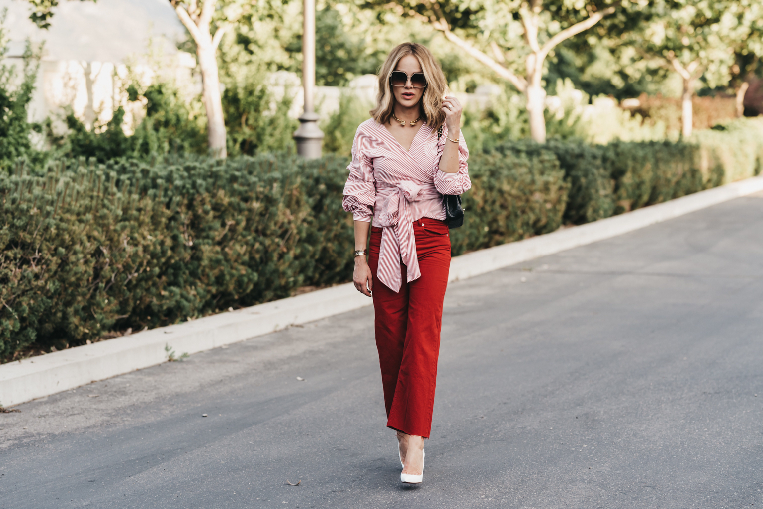 red striped wrap top and red crop jeans • The Fashion Fuse