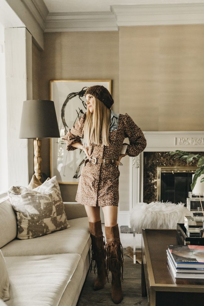 fashion blogger wearing a brown polka-dot dress and a brown western belt with a beanie - Rocky Mountain look